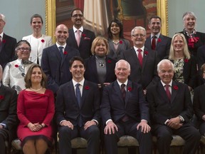 Governor General David Johnston (third from right) and Prime Minister Justin Trudeau (third from left) pose with members of the Liberal cabinet following a swearing-in ceremony, Wednesday Nov.4, 2015 in Ottawa. Trudeau received a lot of attention with his line about the calendar year when asked why he had named an equal number of men and women to cabinet after his newly elected Liberal government was sworn in.
