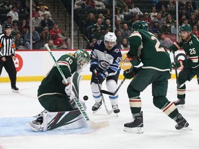 Sep 29, 2019; Saint Paul, MN, USA; Minnesota Wild goalie Devan Dubnyk (40) makes a save against the Winnipeg Jets as forward Mathieu Perreault (85) waits for a rebound during the third period at Xcel Energy Center. Mandatory Credit: Ben Ludeman-USA TODAY Sports