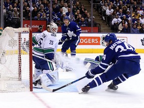 In this Jan. 7, 2018, file photo, Auston Matthews of the Toronto Maple Leafs scores on Jacob Markstrom of the Vancouver Canucks during NHL action at the Air Canada Centre in Toronto on Sunday.