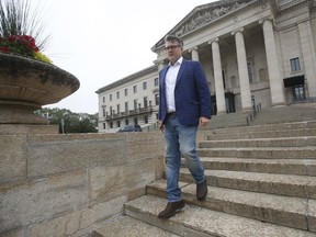 Manitoba Liberal Party leader Dougald Lamont walks to a media interview on election day outside the Manitoba Legislature in Winnipeg, Tuesday, September 10, 2019. Lamont says he plans to stay on as leader after the Manitoba Liberals lost official party status retaining only three seats in Tuesday's election.