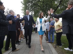 Manitoba Premier Brian Pallister and his wife Esther walk through supporters as he heads to announce that the writ has been dropped and he is calling a September election in Winnipeg Monday, August 12, 2019.