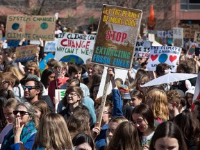 Protesters gather in Civic Square before marching to Parliament during a climate strike protest march in Wellington, New Zealand, on Friday, Sept. 27, 2019.