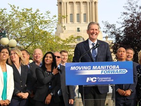 Progressive Conservative leader Brian Pallister speaks alongside his team of candidates behind the Manitoba Legislature on Monday, Sept. 9, 2019. (JOYANNE PURSAGA/Winnipeg Sun/Postmedia Network)