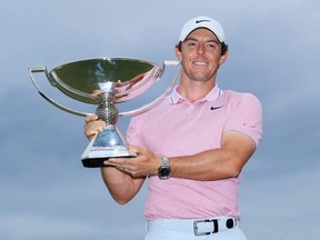 Rory McIlroy of Northern Ireland celebrates with the FedExCup Trophy after the final round of the TOUR Championship at East Lake Golf Club in Atlanta, on Aug. 25, 2019.