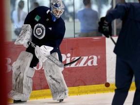 Mikhail Berdin flips a puck during Winnipeg Jets development camp at Bell MTS Iceplex on Wednesday, June 26.