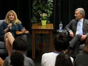 Justice Sheilah Martin (left) of the Supreme Court of Canada and Chief Justice Glenn Joyal of the Court of Queen's Bench of Manitoba speak to students at Kelvin High School in Winnipeg on Monday.