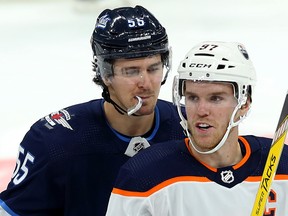 Winnipeg Jets centre Mark Scheifele (left) chirps Edmonton Oilers centre Connor McDavid during NHL pre-season action at Bell MTS Place in Winnipeg on Thurs., Sept. 26, 2019. Kevin King/Winnipeg Sun/Postmedia Network