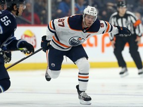 Edmonton Oilers centre Connor McDavid (right) skates up ice during NHL pre-season action against the Winnipeg Jets at Bell MTS Place in Winnipeg on Thurs., Sept. 26, 2019. Kevin King/Winnipeg Sun/Postmedia Network