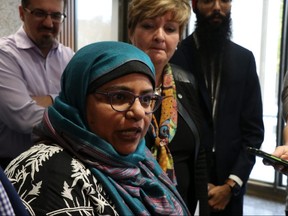 Tasneem Vali addresses the media regarding a motion that will come to council on Oct. 24 to support the opposition to Quebec's Bill 21 as Idris Elbakri, president of the Manitoba Islamic Association, Member of the City of Winnipeg Human Rights Committee, Coun. Janice Lukes and Simarpreet Singh look on at Winnipeg City Hall on Wednesday, Oct. 16, 2019. Josh Aldrich/Winnipeg Sun/Postmedia