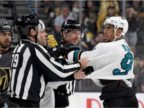 Evander Kane #9 of the San Jose Sharks shoves linesman Kiel Murchison in the third period of the Sharks' preseason game against the Vegas Golden Knights at T-Mobile Arena on September 29, 2019 in Las Vegas, Nevada. Kane received a game misconduct for an abuse of officials penalty. The Golden Knights defeated the Sharks 5-1.
