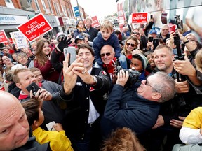 Liberal Leader Justin Trudeau visits a local restaurant during an election campaign visit to Tilbury, Ontario October 14, 2019. REUTERS/Stephane Mahe 4