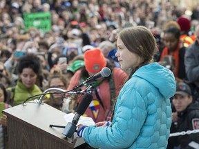 Swedish climate activist Greta Thunberg, in blue jacket, joined about 4,000 Edmonton youth, climate activists, and community members outside the Alberta Legislature in a climate strike. on Friday.