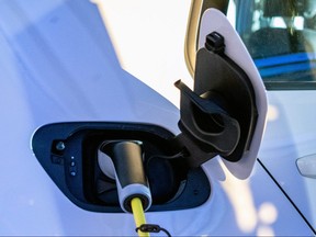 A Volkswagen e-Golf electric car is seen charging during its launch for use in its ride-hailing service in Kigali, Rwanda October 29, 2019. REUTERS/Jean Bizimana