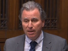 A video grab from footage broadcast by the UK Parliament's Parliamentary Recording Unit (PRU) shows expelled Conservative MP Oliver Letwin speaking to move his ammendment and explain its purpose and effect in the House of Commons in London on October 19, 2019.