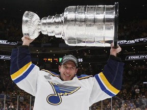 St. Louis Blues goalie Jordan Binnington celebrates with the Stanley Cup in June. GETTY IMAGES