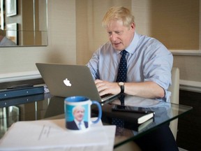 British Prime Minister Boris Johnson prepares his keynote speech which he will deliver to the Conservative Party conference Wednesday, in Manchester, England, on Tuesday, Oct. 1, 2019.