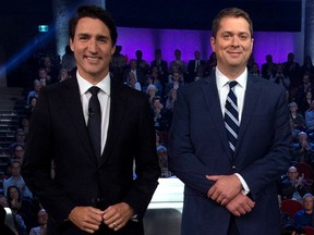Liberal leader and Prime Minister Justin Trudeau stands next to Conservative leader Andrew Scheer before the Federal leaders debate in Gatineau, Quebec, Canada October 7, 2019. Adrian Wyld/Pool via REUTERS ORG XMIT: ajw102R