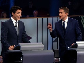 Liberal leader Justin Trudeau and Conservative leader Andrew Scheer take part in the Federal leaders French language debate in Gatineau, Quebec, Canada, October 10, 2019.