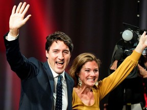 Liberal leader and Canadian Prime Minister Justin Trudeau and his wife Sophie Gregoire Trudeau wave on stage after the federal election at the Palais des Congres in Montreal, Quebec, Canada October 22, 2019.