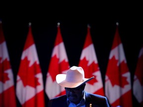 A supporter is seen at Conservative Leader Andrew Scheer's campaign headquarters during the federal election in Regina, on Monday, Oct. 21, 2019.