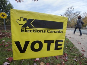 A voter heads to cast their vote in Canada's federal election at the Fairbanks Interpretation Centre in Dartmouth, N.S., Monday, Oct. 21, 2019.