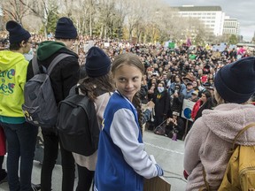Swedish climate activist Greta Thunberg, in blue jacket,   joined about 8,000  Edmonton youth, climate activists, and community members outside the Alberta Legislature in a climate strike. on October 18, 2019. Photo by Shaughn Butts / Postmedia