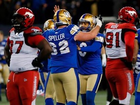 Bombers offensive lineman Cody Soeller congratulates kicker Justin Medlock on his game-winning field goal as the Bombers beat the Calgary Stampeders 29-28 Friday night. Photo by John Woods/Canadian Press