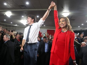 Liberal Leader Justin Trudeau in seen on stage with Nirmala Naidoo, Liberal candidate for Calgary Skyview, during a rally held late Saturday evening at the Magnolia Banquet Hall during the last days of the federal election campaign.