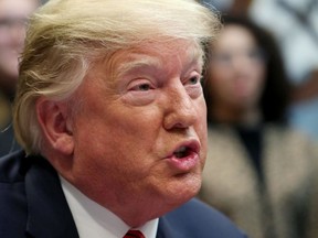 U.S. President Donald Trump holds a congratulatory phone call for the first all-female space walk outside of the International Space Station with astronauts Christina Koch and Jessica Meir at the White House in Washington, D.C., U.S. October 18, 2019.