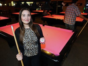 Nicole Roulette, Alfie's Restaurant, Lounge & Billiards manager, displays a pink eight-ball in its lounge on Keewatin Avenue in Winnipeg on Tues., Oct. 1, 2019. Alfie's is supporting the CancerCare Manitoba Foundation with its Alfie's Play for the Cure fundraiser.