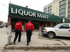 Downtown Watch ambassadors enter the Hargrave & Ellice Liquor Mart location in Winnipeg on Wed., Oct. 2, 2019. Kevin King/Winnipeg Sun/Postmedia Network