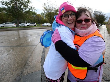 Volunteer Claudette Delorme (right) gets a hug from Laurie Taman during the 28th annual Run for the Cure event for the Canadian Cancer Society, in Winnipeg on Sun., Oct. 6, 2019. Kevin King/Winnipeg Sun/Postmedia Network