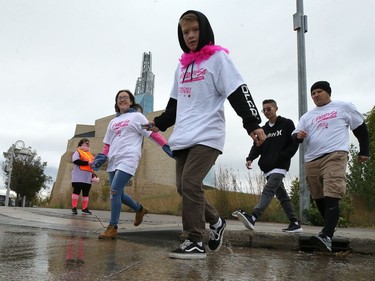 Participants cross Israel Asper Way on their way back to Shaw Park during the 28th annual Run for the Cure event for the Canadian Cancer Society, in Winnipeg on Sun., Oct. 6, 2019. Kevin King/Winnipeg Sun/Postmedia Network
