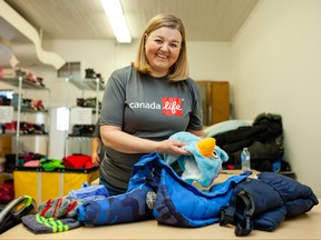 Staff from Canada Life in Winnipeg volunteer for the United Way Winnipeg Koats for Kids program in Winnipeg on Monday, Oct. 7, 2019, sorting and organizing coats and other cold weather gear. Every year, from September to February, Winnipeggers donate over 6,000 coats, and Koats for Kids shares this winter gear with needy Winnipeg families. Tristan Fast/United Way Winnipeg