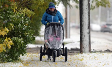 Chantal Young pushes her child along Doncaster Street in the Tuxedo area of Winnipeg on Thurs., Oct. 10, 2019. Kevin King/Winnipeg Sun/Postmedia Network