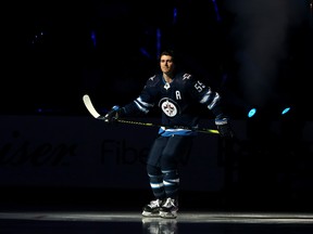 Winnipeg Jets centre Mark Scheifele skates out during player introductions prior to the team's home opener against the Minnesota Wild in Winnipeg on Thurs., Oct. 10, 2019. Kevin King/Winnipeg Sun/Postmedia Network