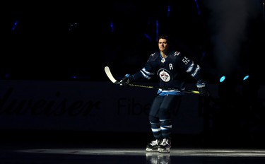 Winnipeg Jets centre Mark Scheifele skates out during player introductions prior to the team's home opener against the Minnesota Wild in Winnipeg on Thurs., Oct. 10, 2019. Kevin King/Winnipeg Sun/Postmedia Network