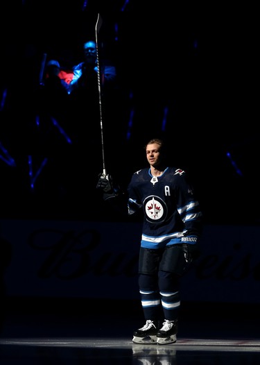 Winnipeg Jets defenceman Josh Morrissey skates out during player introductions prior to the team's home opener against the Minnesota Wild in Winnipeg on Thurs., Oct. 10, 2019. Kevin King/Winnipeg Sun/Postmedia Network
