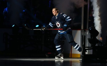 Winnipeg Jets forward Patrik Laine skates out during player introductions prior to the team's home opener against the Minnesota Wild in Winnipeg on Thurs., Oct. 10, 2019. Kevin King/Winnipeg Sun/Postmedia Network