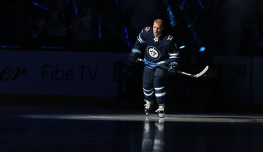 Winnipeg Jets centre Andrew Copp skates out during player introductions prior to the team's home opener against the Minnesota Wild in Winnipeg on Thurs., Oct. 10, 2019. Kevin King/Winnipeg Sun/Postmedia Network