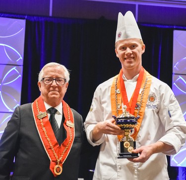 Winnipeg Squash Racquet Club chef Darnell Banman (right) shows off his gold medal of la Chaîne des Rôtisseurs and the Arthur Bolli Memorial Trophy at the competition held in Calgary on Sept. 20, 2019. Twenty-one of the world’s finest young chefs were chosen for 2019 through selection competitions held in their respective countries. As the gold medallist, Banman received a first place prize of a Superior Cuisine training course at Le Cordon Bleu Paris and an executive chef attaché case with a complete set of professional knives. He also received a set of professional Wüsthof carving knives for his exceptional skills and organization in the kitchen during the competition.
