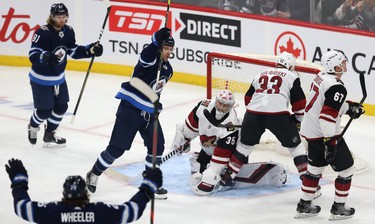 Winnipeg Jets centre Mark Scheifele (centre) celebrates his power-play goal against the Phoenix Coyotes during NHL action in Winnipeg on Tues., Oct. 15, 2019. Kevin King/Winnipeg Sun/Postmedia Network