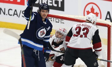 Winnipeg Jets centre Mark Scheifele (left) celebrates his power-play goal against the Phoenix Coyotes during NHL action in Winnipeg on Tues., Oct. 15, 2019. Kevin King/Winnipeg Sun/Postmedia Network