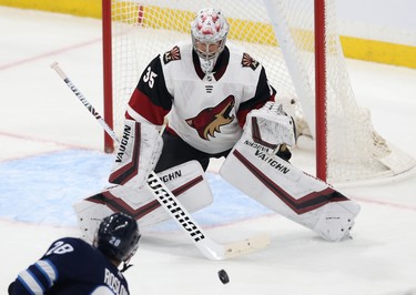 Phoenix Coyotes goaltender Darcy Kuemper stares down a slapper from Winnipeg Jets forward Jack Roslovic during NHL action in Winnipeg on Tues., Oct. 15, 2019. Kevin King/Winnipeg Sun/Postmedia Network