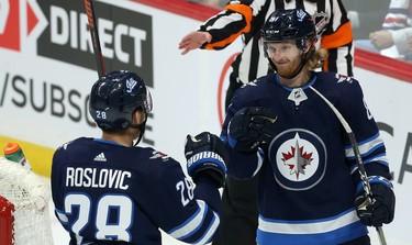 Winnipeg Jets forward Kyle Connor (right) celebrates his power-play goal during the third period of NHL action against the Phoenix Coyotes in Winnipeg on Tues., Oct. 15, 2019. Kevin King/Winnipeg Sun/Postmedia Network