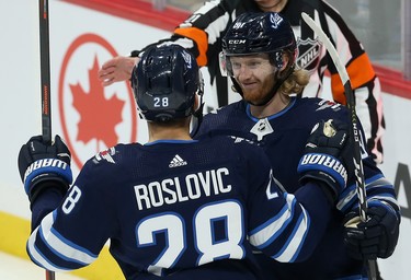 Winnipeg Jets forward Kyle Connor (right) celebrates his power-play goal during the third period of NHL action against the Phoenix Coyotes in Winnipeg on Tues., Oct. 15, 2019. Kevin King/Winnipeg Sun/Postmedia Network