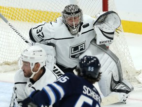 Kings goaltender Jonathan Quick stops a high shot from Jets centre Mark Scheifele in last night at Bell MTS Place. Kevin King/Winnipeg Sun