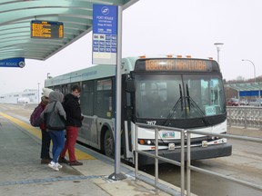 Passengers board a Winnipeg Transit bus at the Southwest Transitway Fort Rouge Station on Tuesday, October 29, 2019. Winnipeg Transit announced changes with the opening of the Southwest Transitway Stage 2 that it promises will see more frequent, faster, and more reliable transit service in southwest Winnipeg. The Blue Line, a new route that will run along the entire length of the Southwest Transitway will connect Downtown with the University Manitoba and St. Norbert. The Blue Line will form the “spine” of the network, while the neighbourhood routes in southwest Winnipeg will form the “feeders.” GLEN DAWKINS/Winnipeg Sun/Postmedia Network