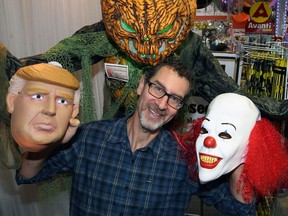 Party Stuff co-owner Jonathan Glass poses with some of the horrors in play for Halloween at the store on Milt Stegall Drive in Winnipeg.