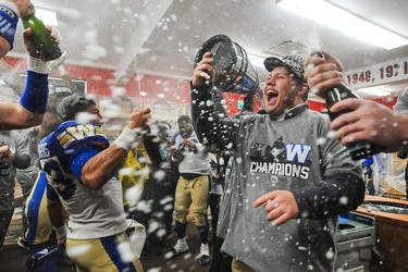 CALGARY, AB - NOVEMBER 24: Andrew Harris #33 of the Winnipeg Blue Bombers celebrates with his teammates after defeating the Hamilton Tiger-Cats during the 107th Grey Cup Championship Game at McMahon Stadium on November 24, 2019 in Calgary, Alberta, Canada. (Photo by Derek Leung/Getty Images)